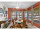 Charming dining room with wood table and chairs, plus large windows at 6825 S Whetstone Pl, Chandler, AZ 85249