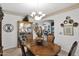 Bright dining area with wood table, chairs, and built in hutch at 6825 S Whetstone Pl, Chandler, AZ 85249