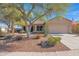 Single-story home with desert landscaping and a two-car garage at 6825 S Whetstone Pl, Chandler, AZ 85249