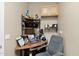 Convenient home office with a built-in desk and shelving at 6825 S Whetstone Pl, Chandler, AZ 85249