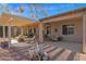 Large covered patio with seating area, fire pit, and pergola at 6825 S Whetstone Pl, Chandler, AZ 85249