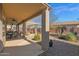 Covered patio with ceiling fan and outdoor seating at 6825 S Whetstone Pl, Chandler, AZ 85249