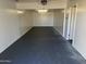 Attached garage with painted floor and extra storage space at 7015 N 23Rd Ln, Phoenix, AZ 85021