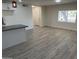 Open living area with wood-look flooring and lots of light at 7015 N 23Rd Ln, Phoenix, AZ 85021