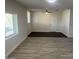 Bright and airy living room with new wood-look flooring at 7015 N 23Rd Ln, Phoenix, AZ 85021