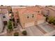 Two-story house with tile roof, two-car garage, and front yard landscaping at 7019 W Mcmahon Way, Peoria, AZ 85345