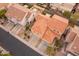 Aerial view showing house's tile roof, landscaping, and surrounding neighborhood at 7019 W Mcmahon Way, Peoria, AZ 85345