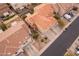 Aerial view of two-story house with tile roof, landscaping, and driveway at 7019 W Mcmahon Way, Peoria, AZ 85345