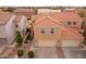 Two-story house with tile roof, two-car garage, and landscaped yard at 7019 W Mcmahon Way, Peoria, AZ 85345