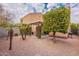 Backyard view showcasing a covered patio and citrus trees at 7019 W Mcmahon Way, Peoria, AZ 85345