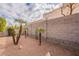 Simple backyard with gravel, block wall, and palm trees at 7019 W Mcmahon Way, Peoria, AZ 85345