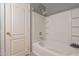 Bathroom with a shower/tub combo and built-in shelving at 7019 W Mcmahon Way, Peoria, AZ 85345