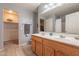 Double vanity bathroom with a large mirror and linen closet at 7019 W Mcmahon Way, Peoria, AZ 85345