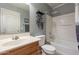 Clean bathroom with a tub, shower, and wood vanity at 7019 W Mcmahon Way, Peoria, AZ 85345