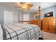 Main bedroom with wooden furniture and a flat-screen TV at 7019 W Mcmahon Way, Peoria, AZ 85345