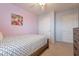 Bright bedroom featuring double doors and wood flooring at 7019 W Mcmahon Way, Peoria, AZ 85345