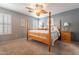 Main bedroom with a wooden bed frame and ceiling fan at 7019 W Mcmahon Way, Peoria, AZ 85345