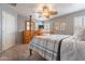 Main bedroom with wooden furniture and a flat-screen TV at 7019 W Mcmahon Way, Peoria, AZ 85345