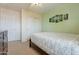 Serene bedroom with double doors and a ceiling fan at 7019 W Mcmahon Way, Peoria, AZ 85345