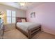 Cozy bedroom with wood bed frame and window shutters at 7019 W Mcmahon Way, Peoria, AZ 85345