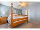 Main bedroom with a wooden bed frame and ceiling fan at 7019 W Mcmahon Way, Peoria, AZ 85345