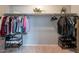 Walk-in closet with ample shelving and hanging space at 7019 W Mcmahon Way, Peoria, AZ 85345