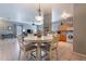 Bright dining area with a round table and four chairs, adjacent to kitchen at 7019 W Mcmahon Way, Peoria, AZ 85345