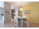 Bright dining area with a white table and four chairs at 7019 W Mcmahon Way, Peoria, AZ 85345