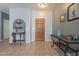 Entryway with tile flooring, wooden door, and decorative console table at 7019 W Mcmahon Way, Peoria, AZ 85345