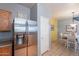 Kitchen features a stainless steel refrigerator and oak wood cabinets at 7019 W Mcmahon Way, Peoria, AZ 85345