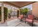 Relaxing covered patio with seating and string lights at 7019 W Mcmahon Way, Peoria, AZ 85345