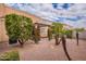 Small patio area with pergola and lush landscaping at 7019 W Mcmahon Way, Peoria, AZ 85345