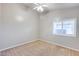 Well-lit bedroom with neutral walls and carpet at 7132 W Villa Chula --, Glendale, AZ 85310