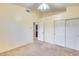 Well-lit bedroom with double door closet and carpet flooring at 7132 W Villa Chula --, Glendale, AZ 85310