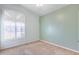 Bedroom with arched window and painted accent wall at 7132 W Villa Chula --, Glendale, AZ 85310