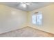 Bright bedroom featuring a ceiling fan and window shutters at 7132 W Villa Chula --, Glendale, AZ 85310