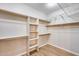 Large walk-in closet with shelves and hanging rods at 7132 W Villa Chula --, Glendale, AZ 85310