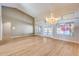 Bright dining room with hardwood floors and chandelier at 7132 W Villa Chula --, Glendale, AZ 85310