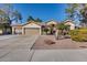 Beautiful tan house with three car garage at 7132 W Villa Chula --, Glendale, AZ 85310