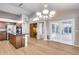 Kitchen with dark wood cabinets and granite island at 7132 W Villa Chula --, Glendale, AZ 85310