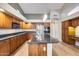 Kitchen with dark wood cabinets and granite island at 7132 W Villa Chula --, Glendale, AZ 85310