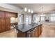 Kitchen with dark wood cabinets and granite island at 7132 W Villa Chula --, Glendale, AZ 85310