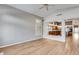 Living room with wood floors and view of kitchen through a large window at 7132 W Villa Chula --, Glendale, AZ 85310