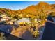 Aerial view of single story home with desert landscaping, pool, and mountain views at 7501 N 22Nd Pl, Phoenix, AZ 85020