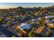 Aerial view showing a house with a pool, surrounded by other houses and mountains at 7501 N 22Nd Pl, Phoenix, AZ 85020