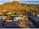 Aerial view showcasing a single story home with a mountain backdrop at 7501 N 22Nd Pl, Phoenix, AZ 85020