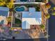 Aerial view of single-story home with a white roof, pool, and patio at 7501 N 22Nd Pl, Phoenix, AZ 85020