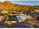 Aerial view of single story home with pool, landscaping and mountain views at 7501 N 22Nd Pl, Phoenix, AZ 85020