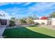 Landscaped backyard with artificial turf and desert landscaping at 7501 N 22Nd Pl, Phoenix, AZ 85020