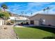 Inviting backyard with a pool, patio, and artificial turf, plus a detached garage at 7501 N 22Nd Pl, Phoenix, AZ 85020